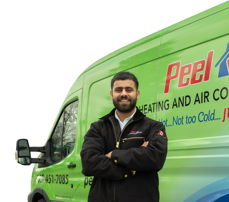 Two Peel technicians smiling in front of their green service van, wearing issued jackets during an on-site consultation.