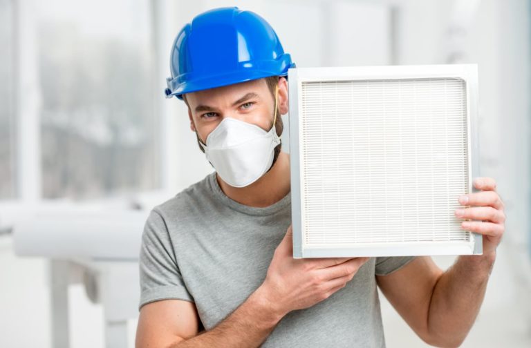 technician-holding-filter-1-768×504-1 technician-holding-filter-1-768×504-1