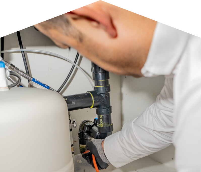 A Peel plumbing specialist uses a hydro jet to clear a clogged drain.