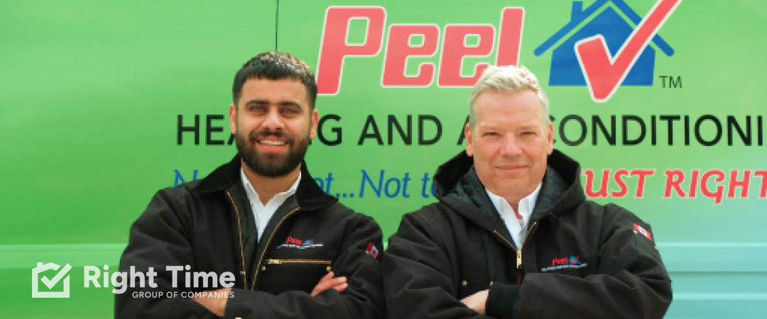 Two Peel Heating technicians standing together in front of a service van before fall furnace and basement airflow maintenance.